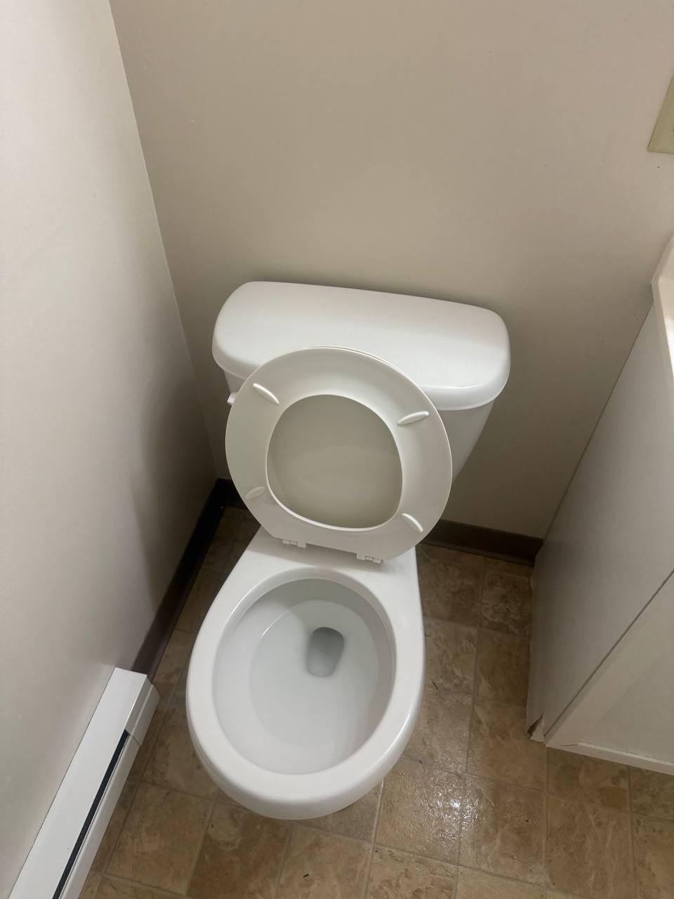 Toilet and bathroom floor after cleaning