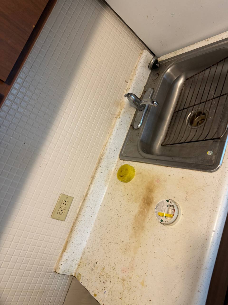 Kitchen sink and counter before cleaning