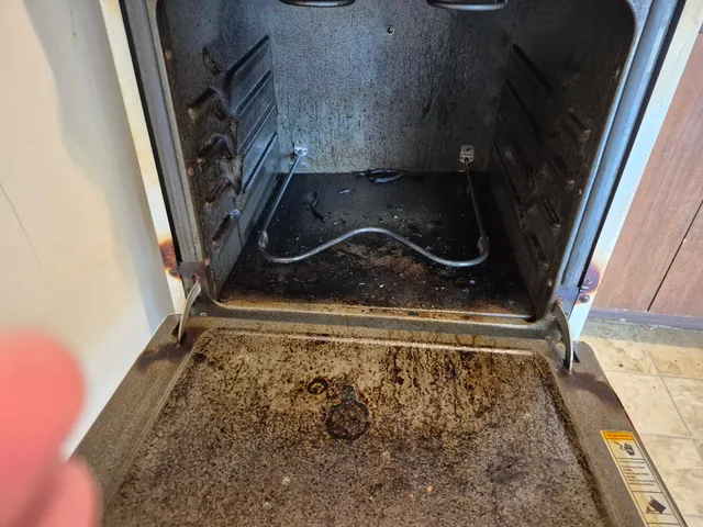 Dirty oven interior before deep cleaning